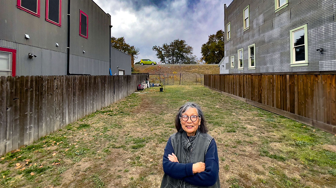 Jean Jokotobi stands on the vacant lot that will become the Asian Heritage Park. She has been working for such a park for more that 15 years. Photo: Rich Turner